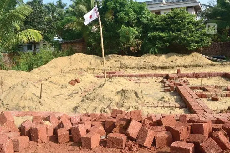 DYFI workers destroy under-construction house in Kanhangad and plant flag