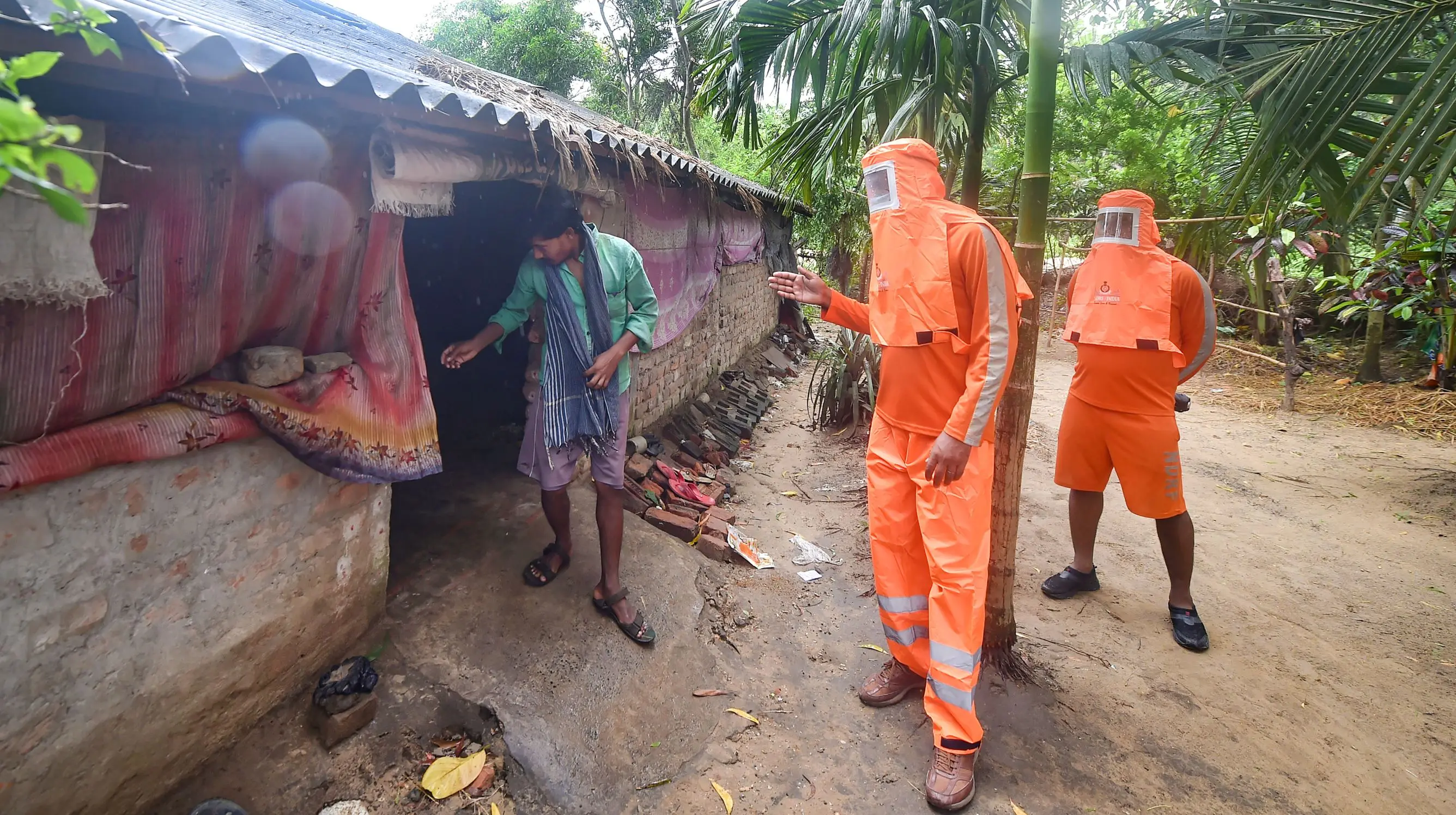 NDRF personnel alert people residing near coastal areas to evacuate ahead of Cyclone 'Yaas' landfall, at Digha in East Midnapore district on Tuesday | Photo:PTI