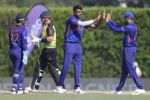 Ravichandran Ashwin, centre after dismissing Australia's David Warner I AP