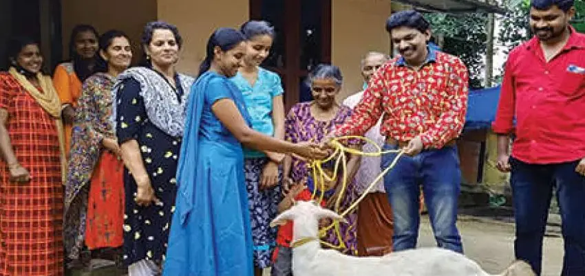 Santhosh Pandit gives goat to a family in Wayanad | Photo: Mathrubhumi