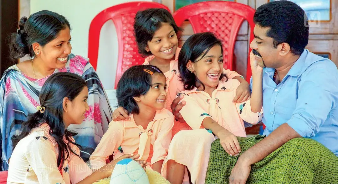 Thomas and Neena with their four daughters