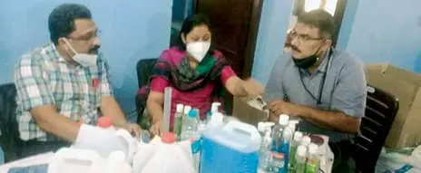 Officers inspecting spurious sanitizer