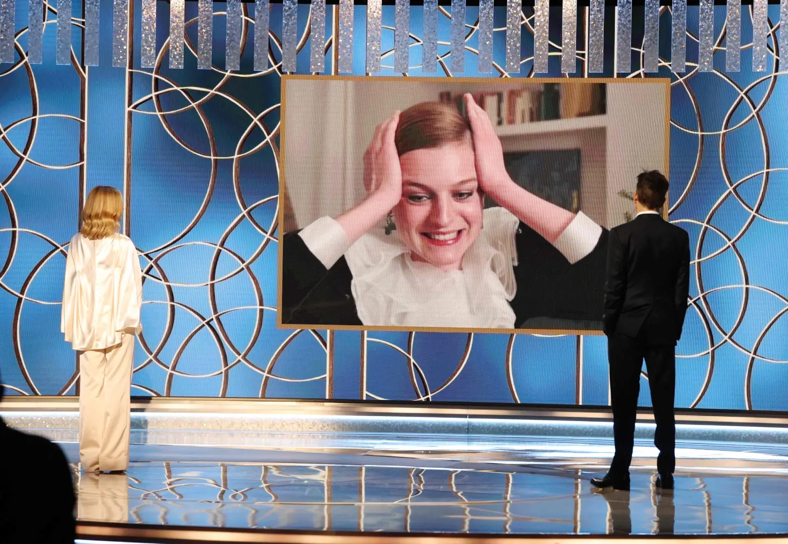 This handout photo courtesy of NBCUniversal shows Emma Corrin (on screen) accepting the Best Television Actress – Drama Series award for 'The Crown' via video from Kyra Sedgwick and Kevin Bacon at the 78th Annual Golden Globe Awards held at the Beverly Hilton Hotel on February 28 | Photo: AFP