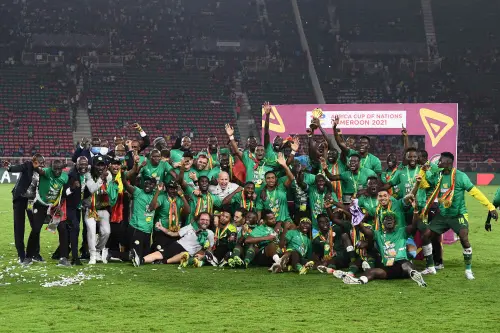 Senegal's players celebrate with the trophy | AFP