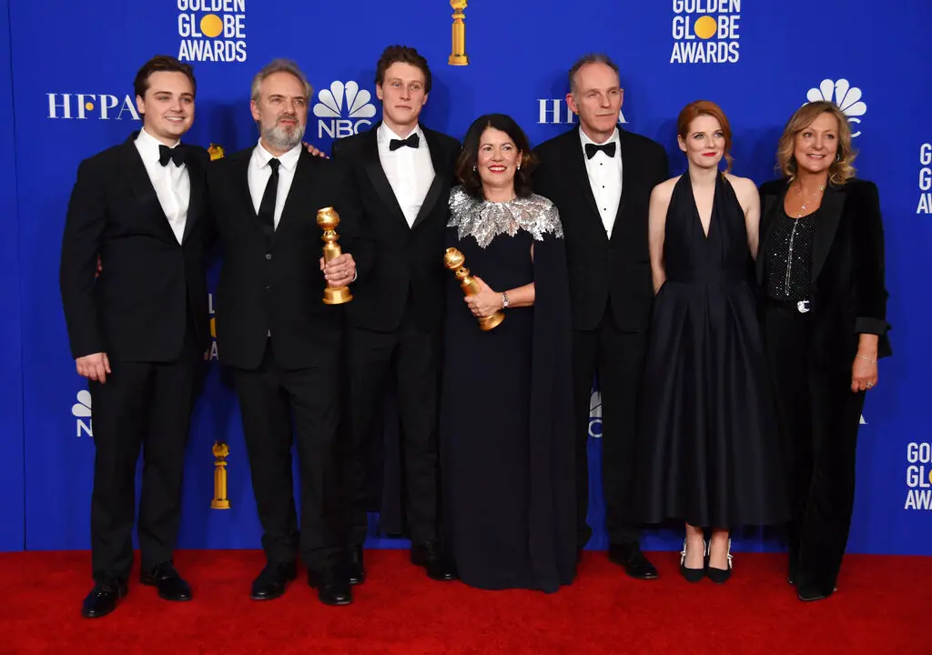 Cast and crew of '1917,' pose with the award for best motion picture drama at the 77th annual Golden Globe Awards at the Beverly Hilton Hotel