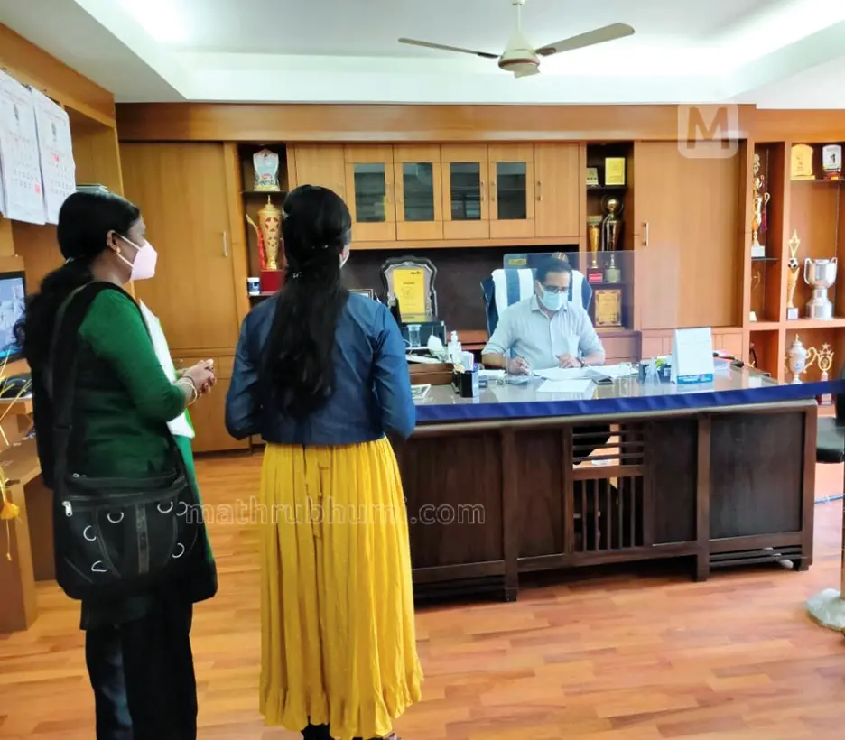 Manju and her daughter inside the cabin of Dr K M Naseer, Principal of Farook College in Kozhikode
