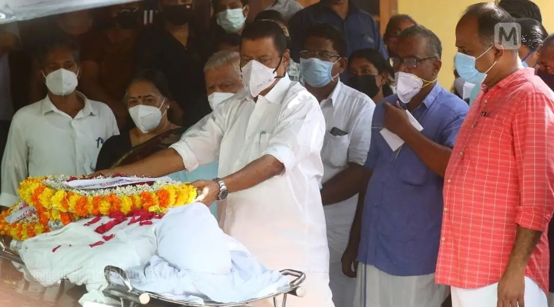 Minister M V Govindan Master paying homage when Manasa's body was brought home | Photo: Ridhin Damu I Mathrubhumi