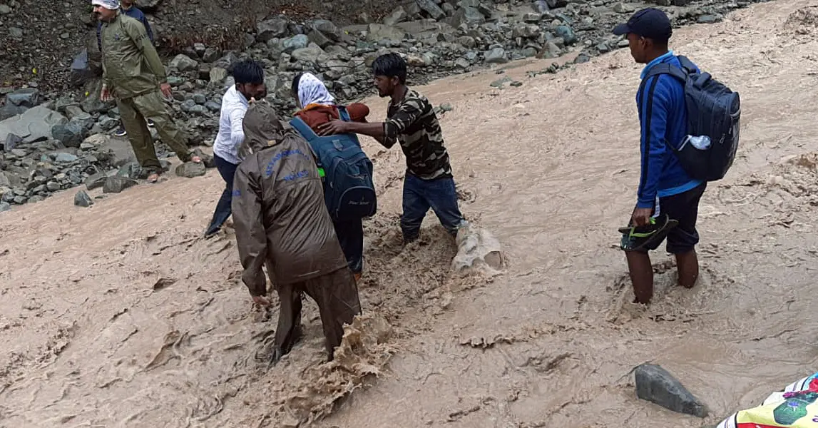 Police personnel rescue stranded devotees in Uttarakhand I ANI