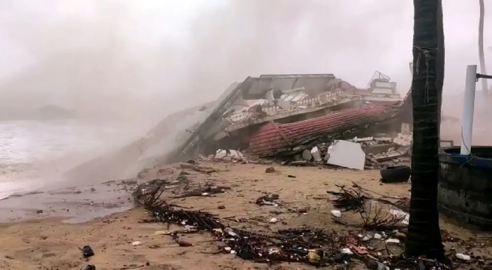 Two-storeyed house collapses due to high tides at sea due to Cyclone 'Tauktae, in Uppala | ANI Photo