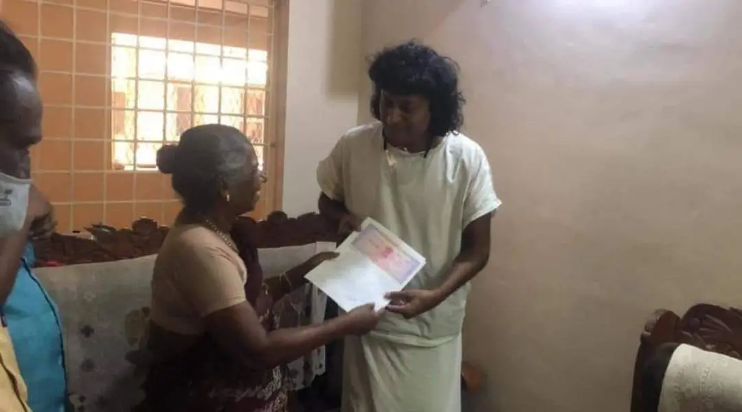 Boby Chemmanur receiving documents from landlady Vasantha | Photo: Social media