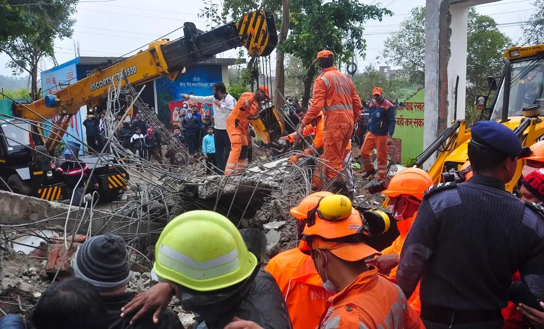 Rescue operation carried out by NDRF personnel after the complex roof of a  crematorium collapsed due to heavy rain, at Muradnagar in Ghaziabad, Sunday | Photo: PTI