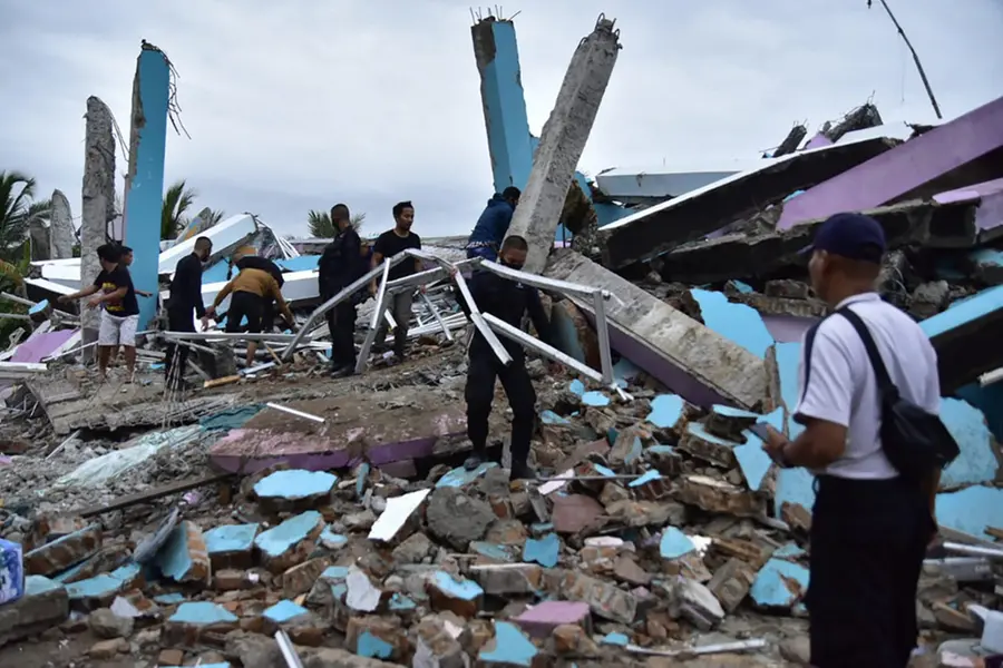 Patients, staff trapped in rubble of hospital flattened by Indonesia quake