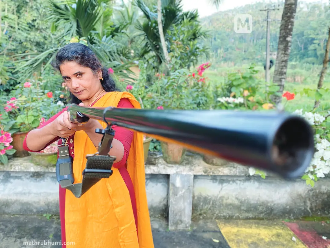 Babitha Benny with gun
