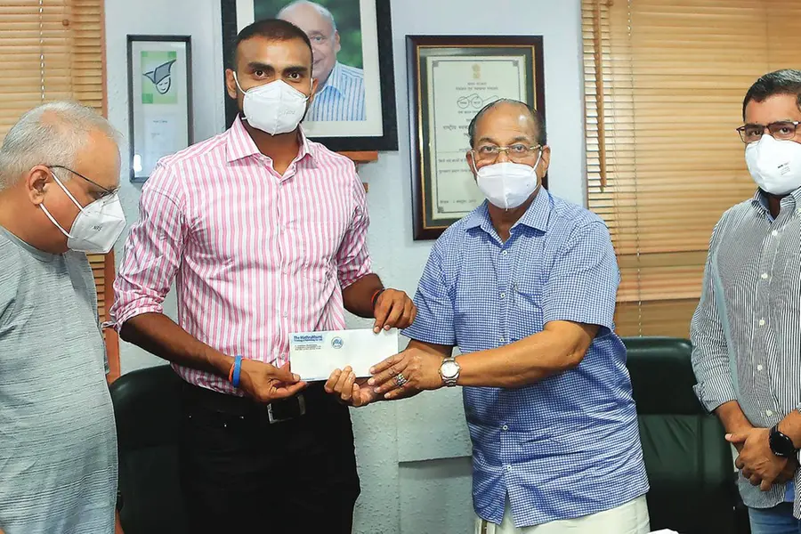 Mathrubhumi hands over Rs 2 lakh reward to P R Sreejesh