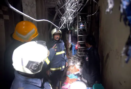 Firefighters inspect accident site in Dharavi I Photo: ANI