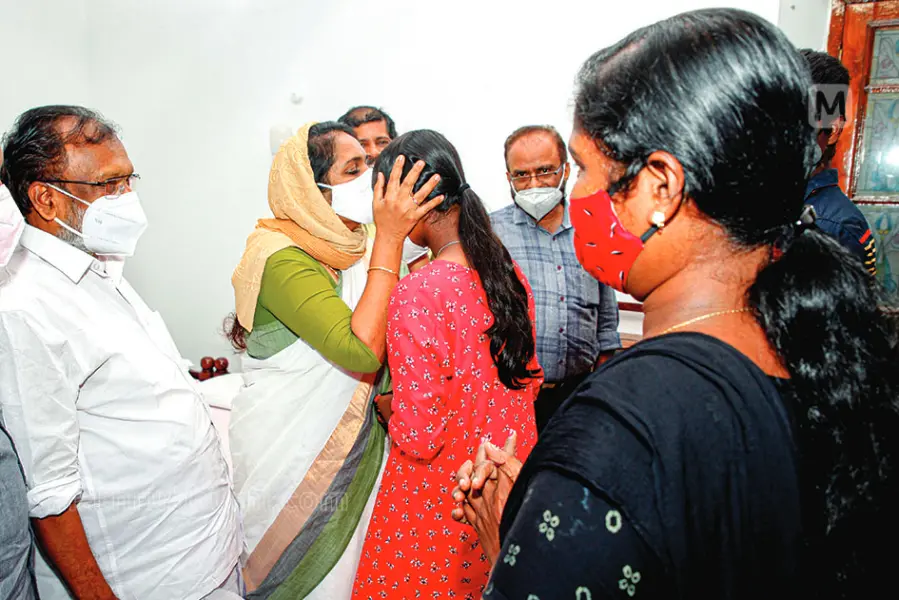 Women's commission member Shahida Kamal hugging Manju's daughter