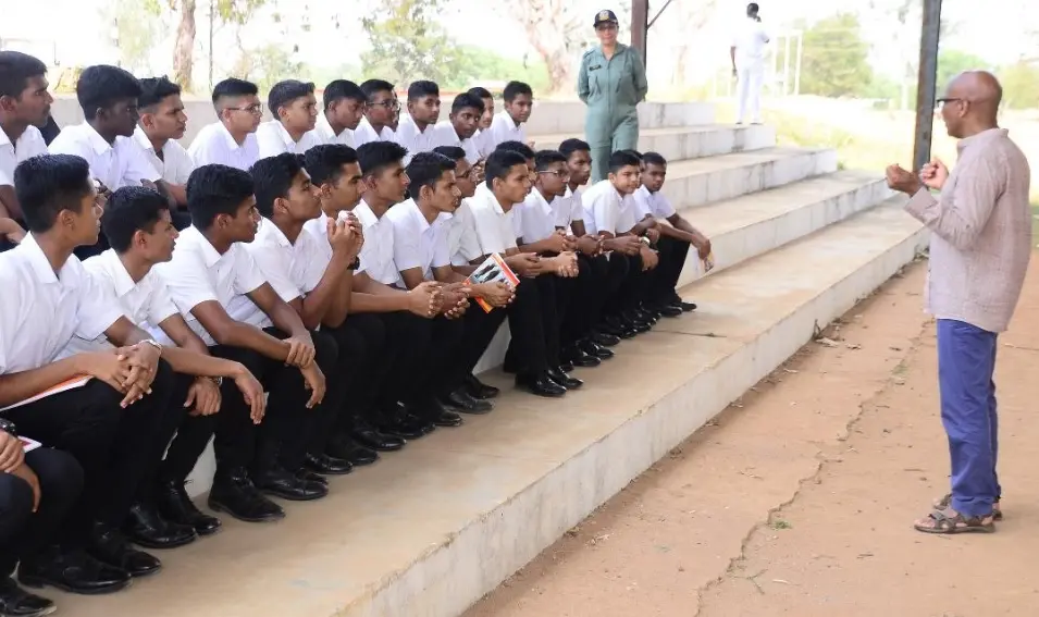 Caribbean author and MBIFL '20 delegate, Luke Daniels, addresses students of Xth and XIth standards as Vice-Principal, Wing Commander Alka Chaudhary looks on | Photo: Special arrangement