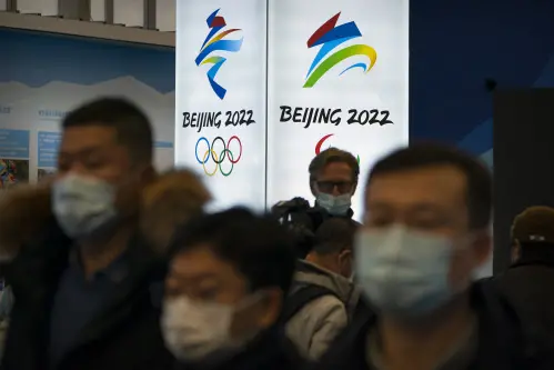 Tokyo hands Olympic baton to Beijing but virus, boycott calls weigh