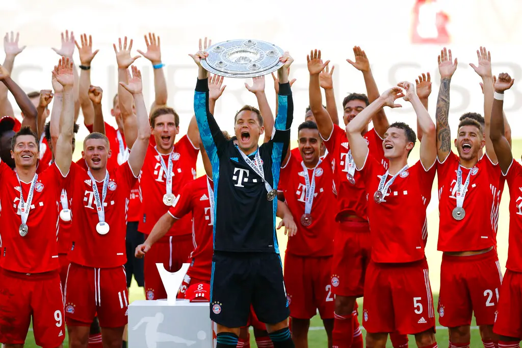 FC Bayern Munich team captain Manuel Neuer lifts the Bundesliga trophy (AP photo)