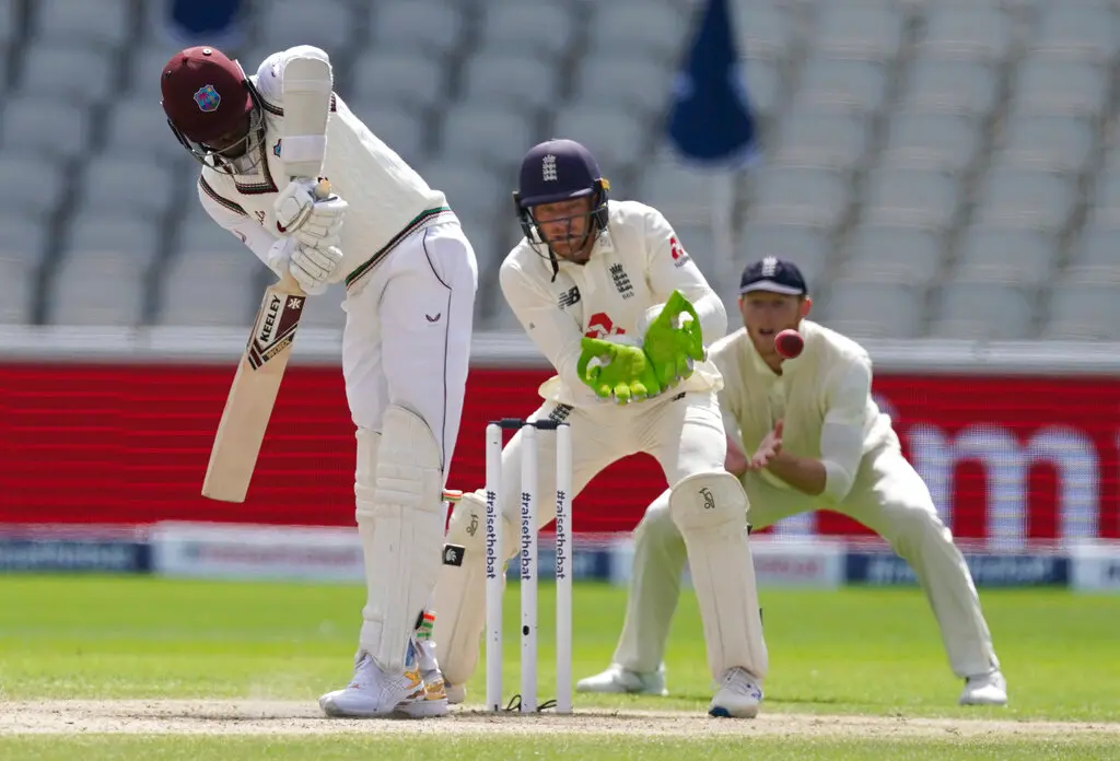 West Indies' Alzarri Joseph, left, hits the ball during the fourth day of the second cricket Test match between England and West Indies at Old Trafford in Manchester, England. (AP Photo)