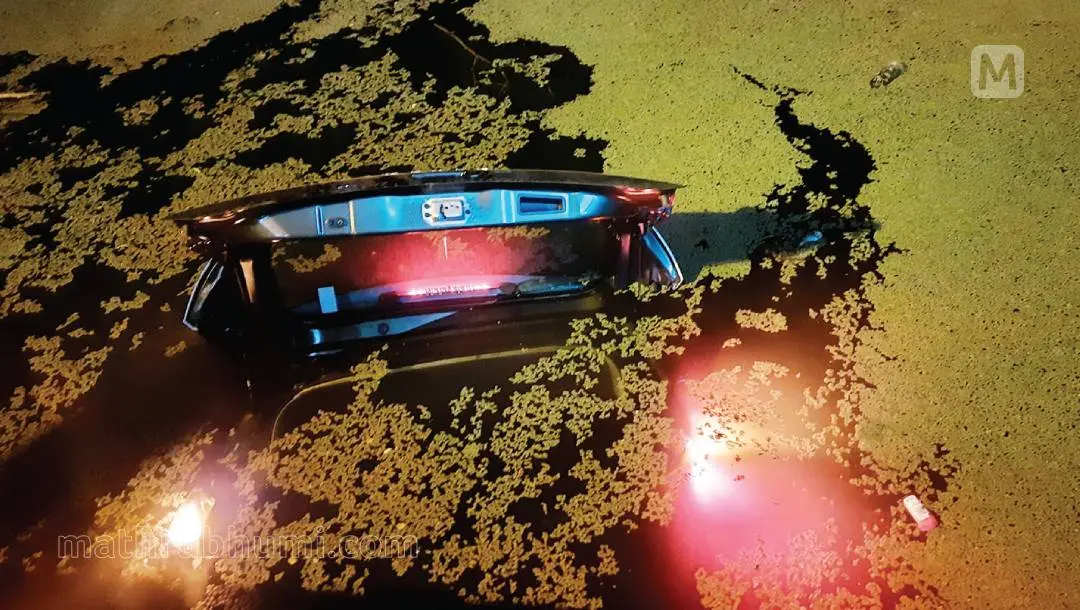 Car which fall into weed filled pond in Thrippunithura