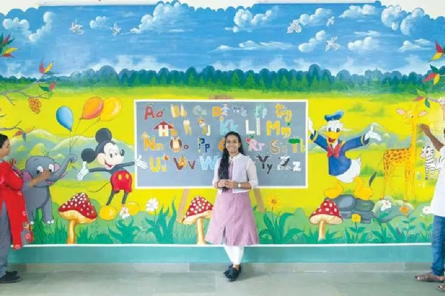 Colorful gift to alma mater; girl draws pictures on walls of school during lockdown