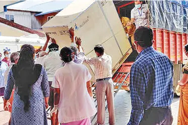 Health workers unload COVID testing equipment after CITU porters demand Rs 16,000
