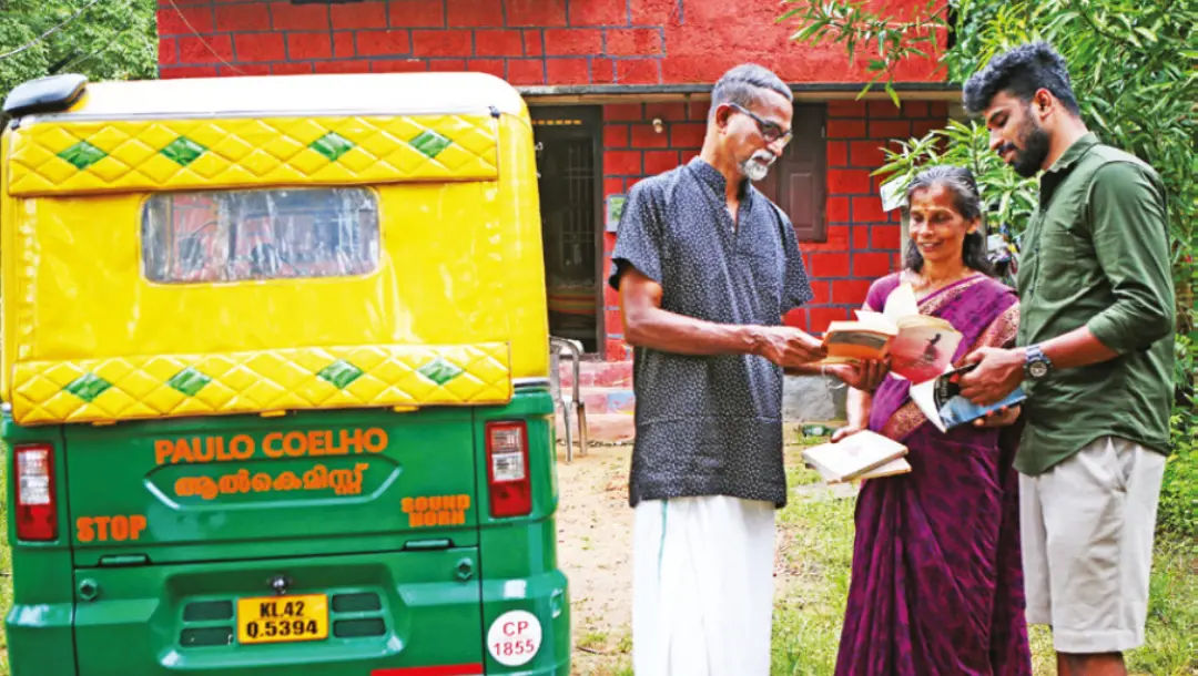 KA Pradeep along with his family members near the auto rickshaw