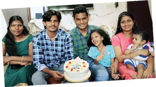 Malayali family celebrating recovery from COVID by cutting cake. (Photo: PG Unnikrishnan)