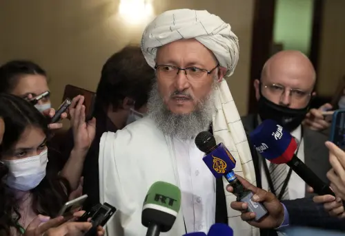 Taliban official Abdul Salam Hanafi, center, speaks to media in Moscow I AP