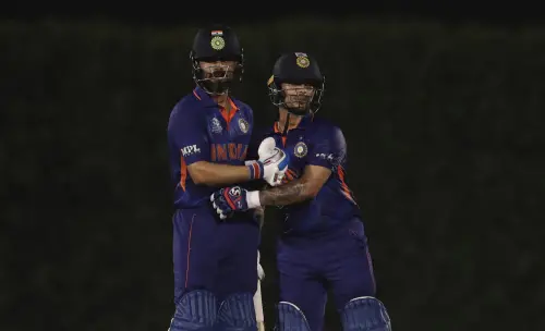 Virat Kohli, left, with Ishan Kishan I AP