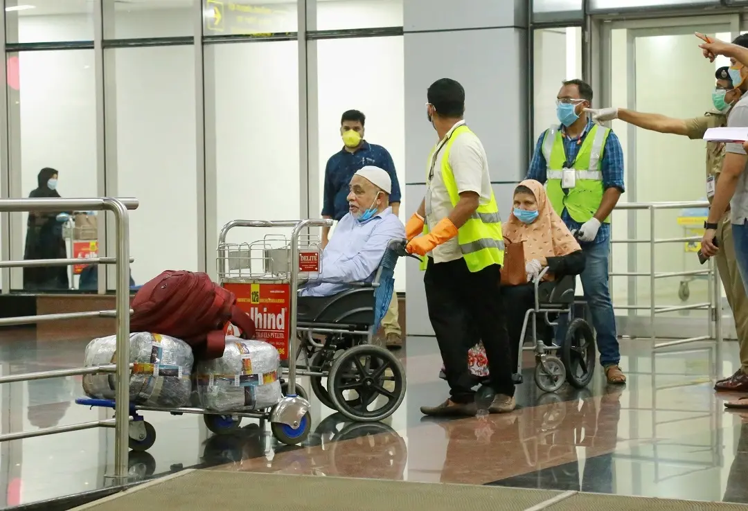 Indian nationals stranded in UAE due to COVID-19 pandemic, on their arrival at Calicut International Airport Kozhikode, in the wee hours of Friday. (PTI Photo)