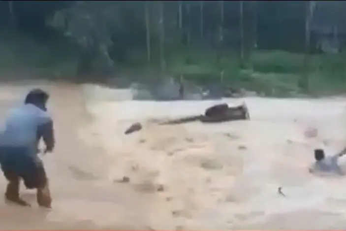 Heavy rain in Attappadi; Narrow escape for man and son as car washes away
