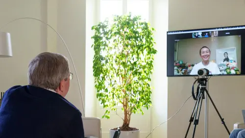 IOC President Thomas Bach holding a video call with Chinese tennis star Peng Shuai | AFP