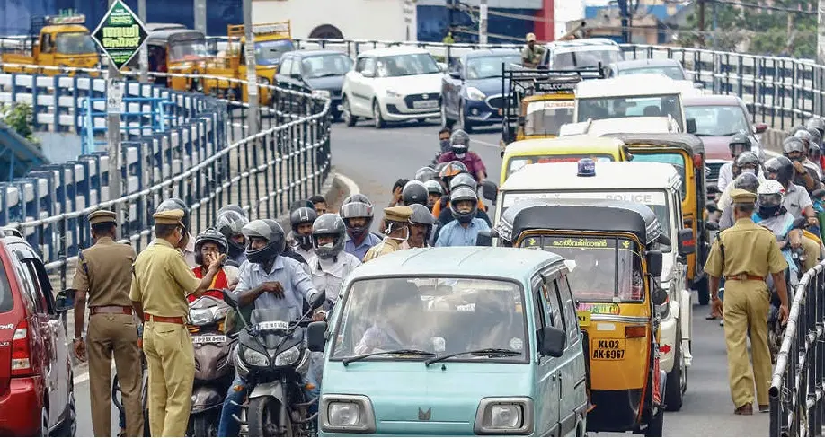 Police officers checking vehicles at Kollam Chinnakakda overbridge and sending back those came out for invalid reasons. Photo: Ajith Panachikkal