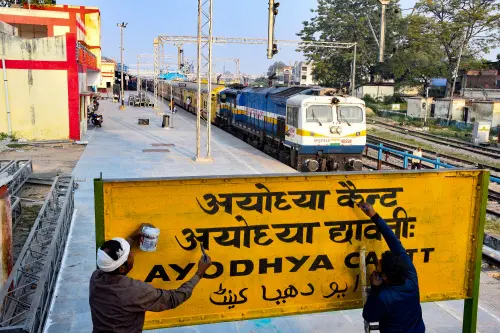 Painters paint the Faizabad Junction railway station's name board as 'Ayodhya Cantonment' after the UP government's decision to change the name of the station, in Faizabad, Thursday, Nov, 4, 2021 | Photo: PTI