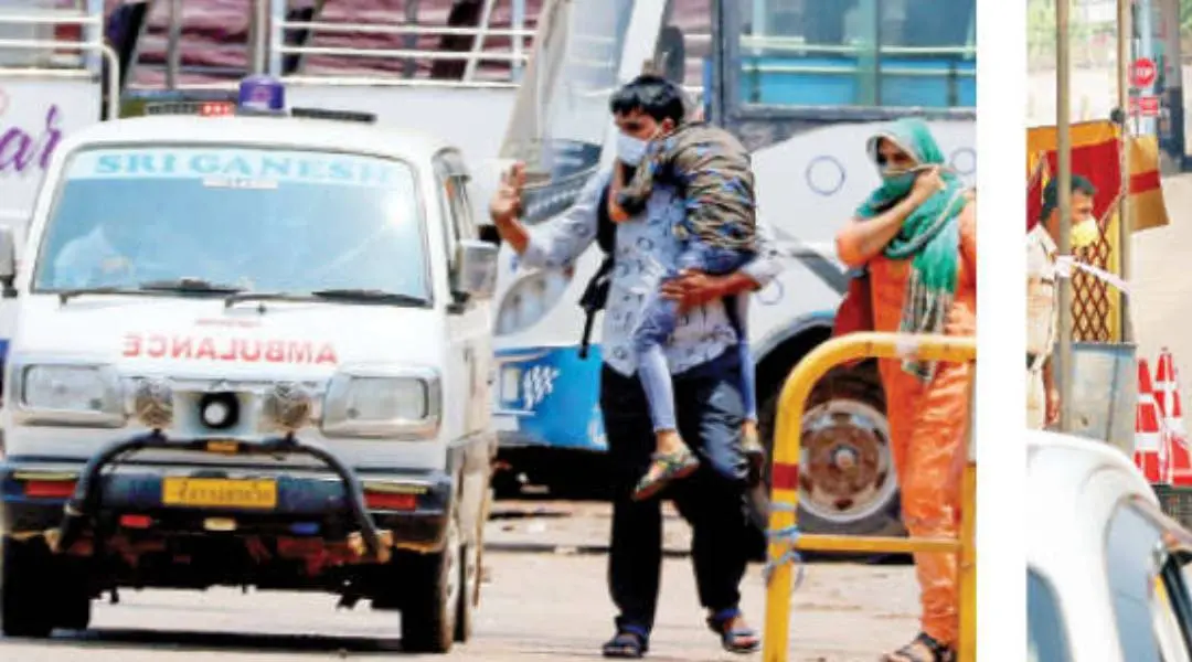 Thamarassery native Nishad and Sajida taking their son Nisham in ambulance near toll gate on the Karnataka border. Photo: Ramanatha Pai