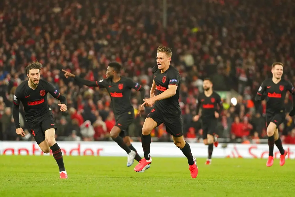 Atletico Madrid's Marcos Llorente, center, celebrates scoring against Liverpool (AP photo)