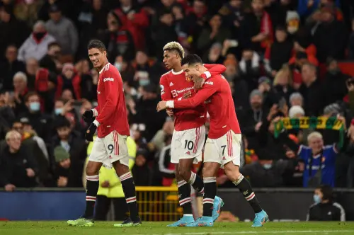 Cristiano Ronaldo (R) celebrates Marcus Rashford (C) | AFP