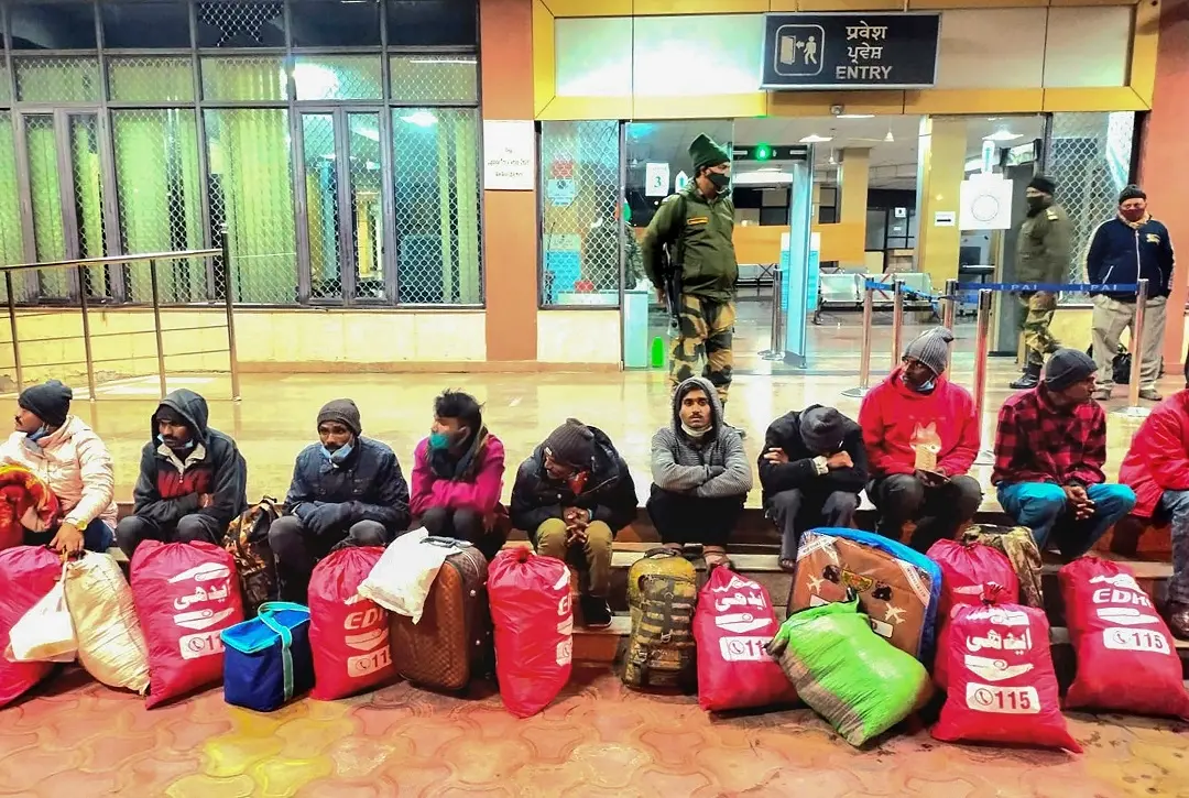 Indian fishermen released by Pakistan sit at the Integrated Check Post (ICP) at Attari, near Amritsar. Photo:PTI
