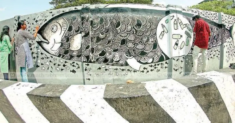 Kajal Dutt and group painting near Kanhikkuzhi railway overbridge