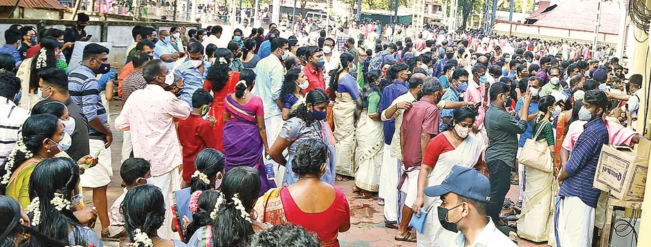 Rush outside the Melpathur Auditorium