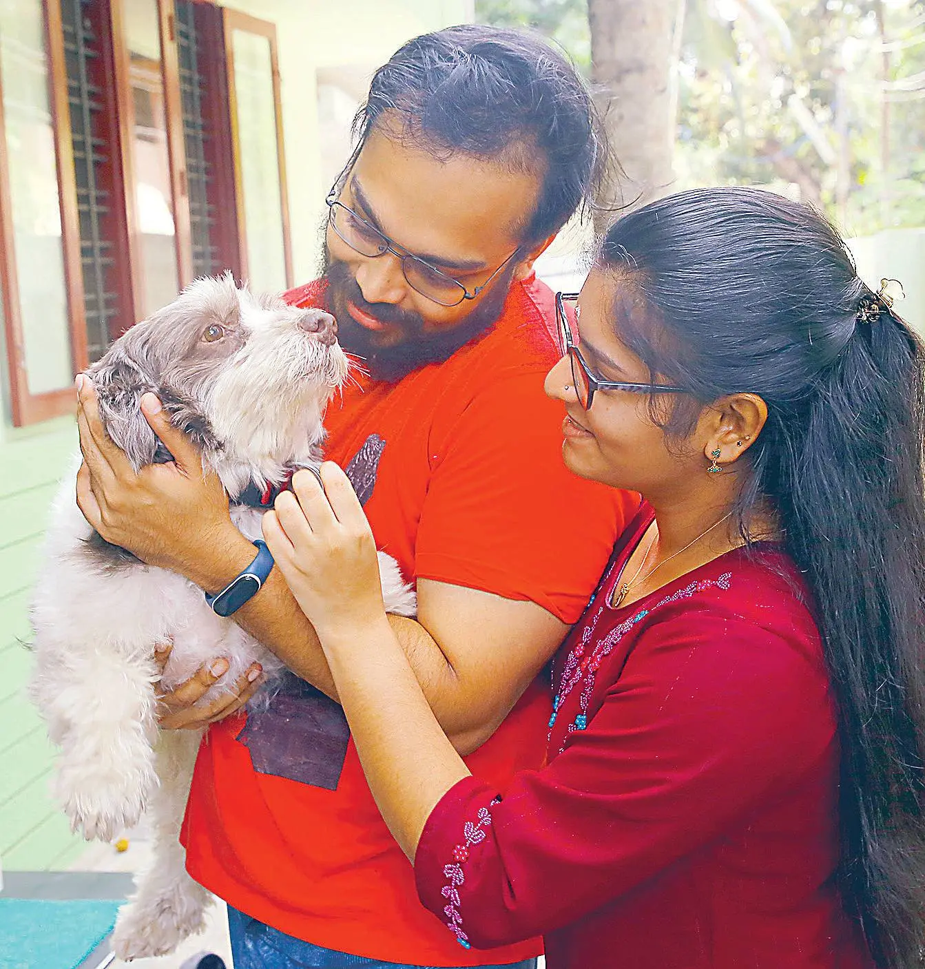 Naveen and his wife Lakshmi with Bruno