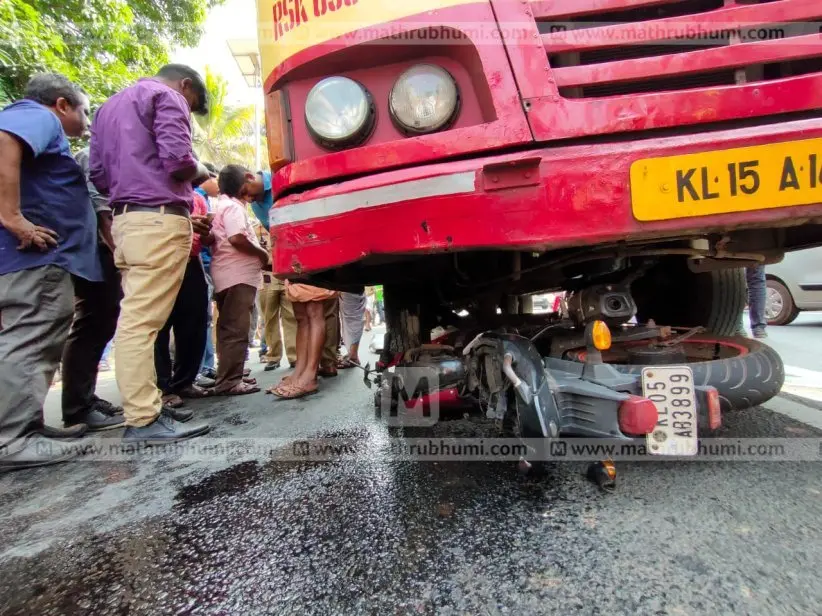 Bike lying under KSRTC bus. Photo: G Sivaprasad