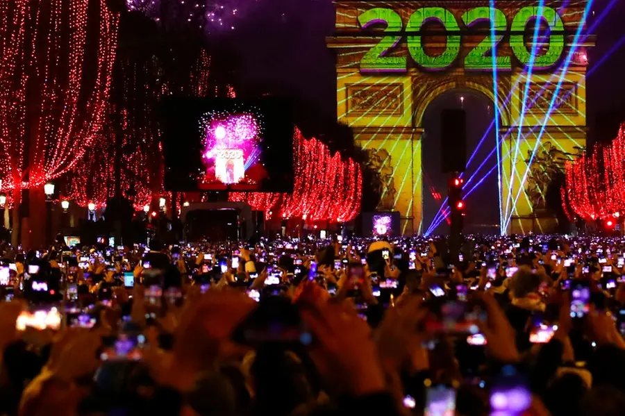 Cheers, tears, prayers for 2020: A new decade is ushered in