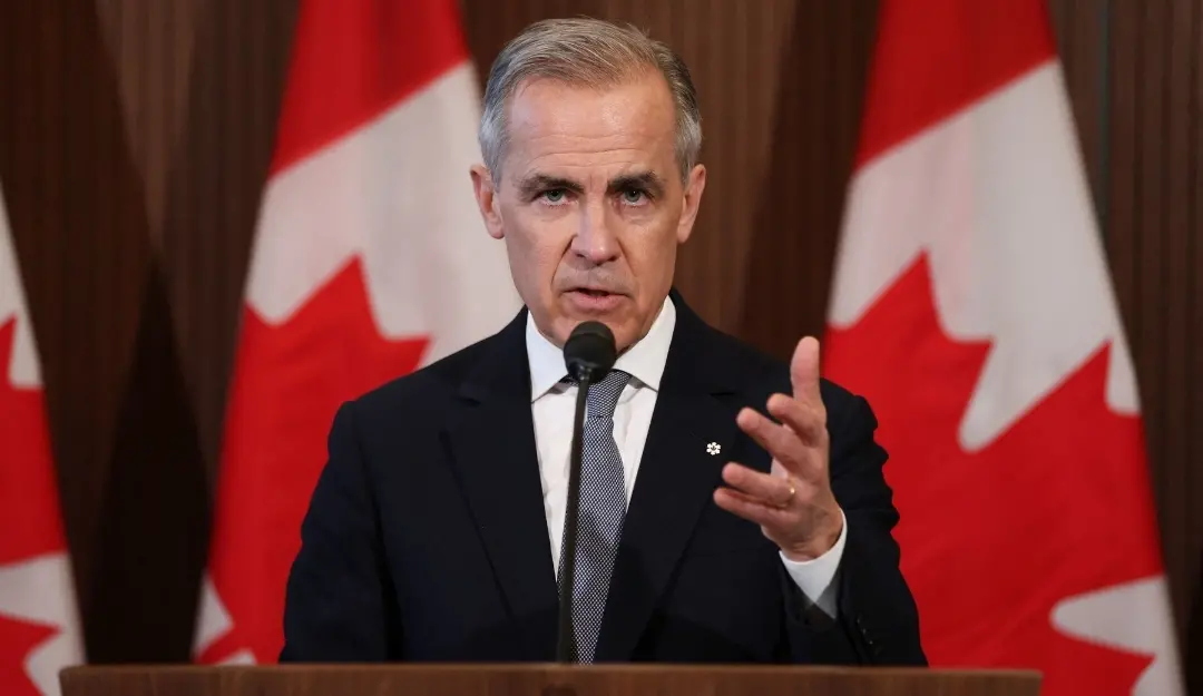 Canada's Prime Minister Mark Carney speaks to the media after meeting with his cabinet to deal with the US auto tariffs on Parliament Hill in Ottawa. | Photo: AFP
