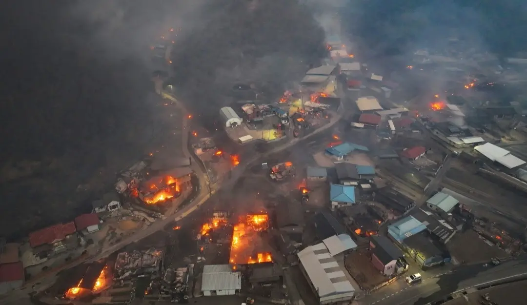 Houses burn in a village after being engulfed by a wildfire fueled by strong winds in Uiseong, South Korea