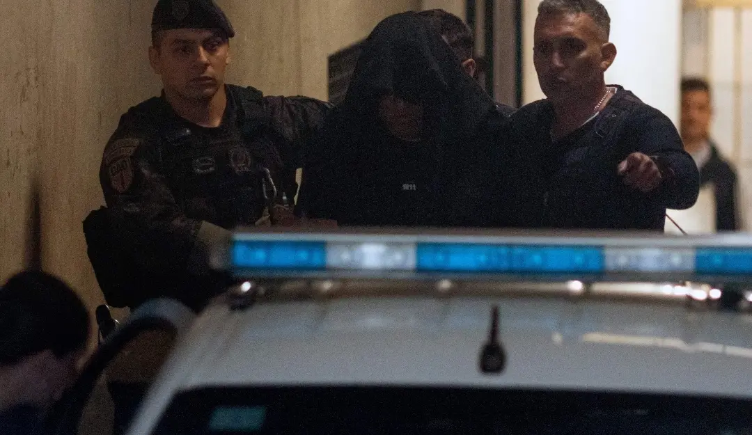 Julio Coria, former security of late Argentine football legend Diego Maradona, is escorted after being detained for false testimony at the San Isidro court in San Isidro, Argentina.