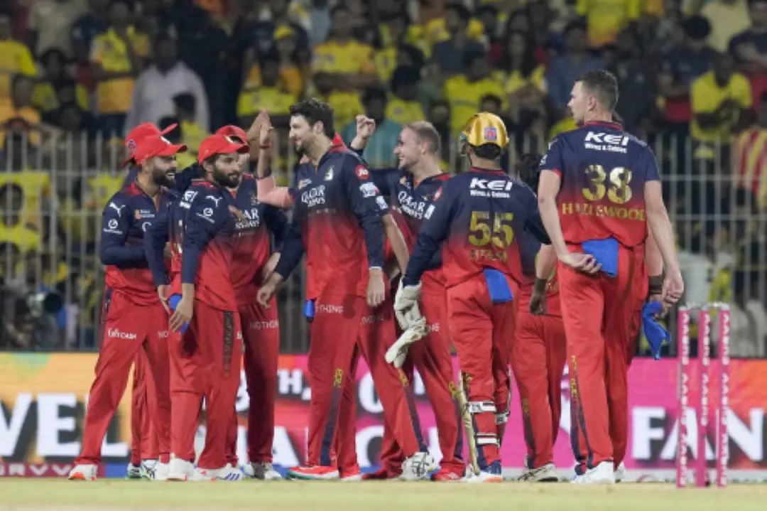 Royal Challengers Bengaluru's Liam Livingstone celebrates with teammates after taking the wicket of Chennai Super Kings' Sam Curran during an Indian Premier League (IPL) 2025 T20 cricket match between Chennai Super Kings and Royal Challengers Bengaluru, at the MA Chidambaram Stadium, in ChennaI. | Photo: PTI