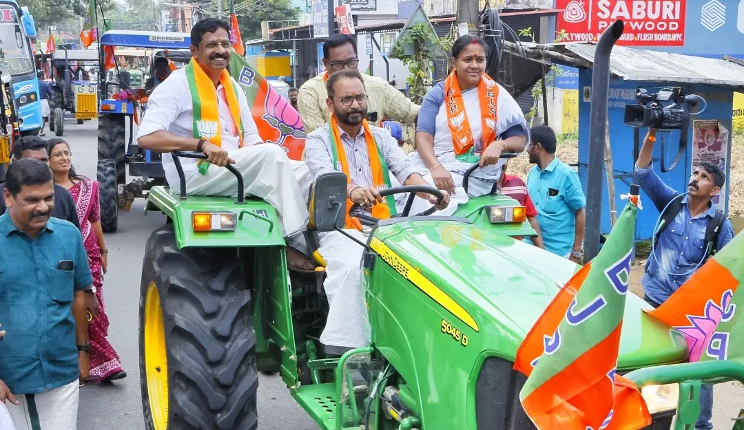 Then BJP state president K Surendran drives a tractor during a rally in the 2024 Palakkad by-election.